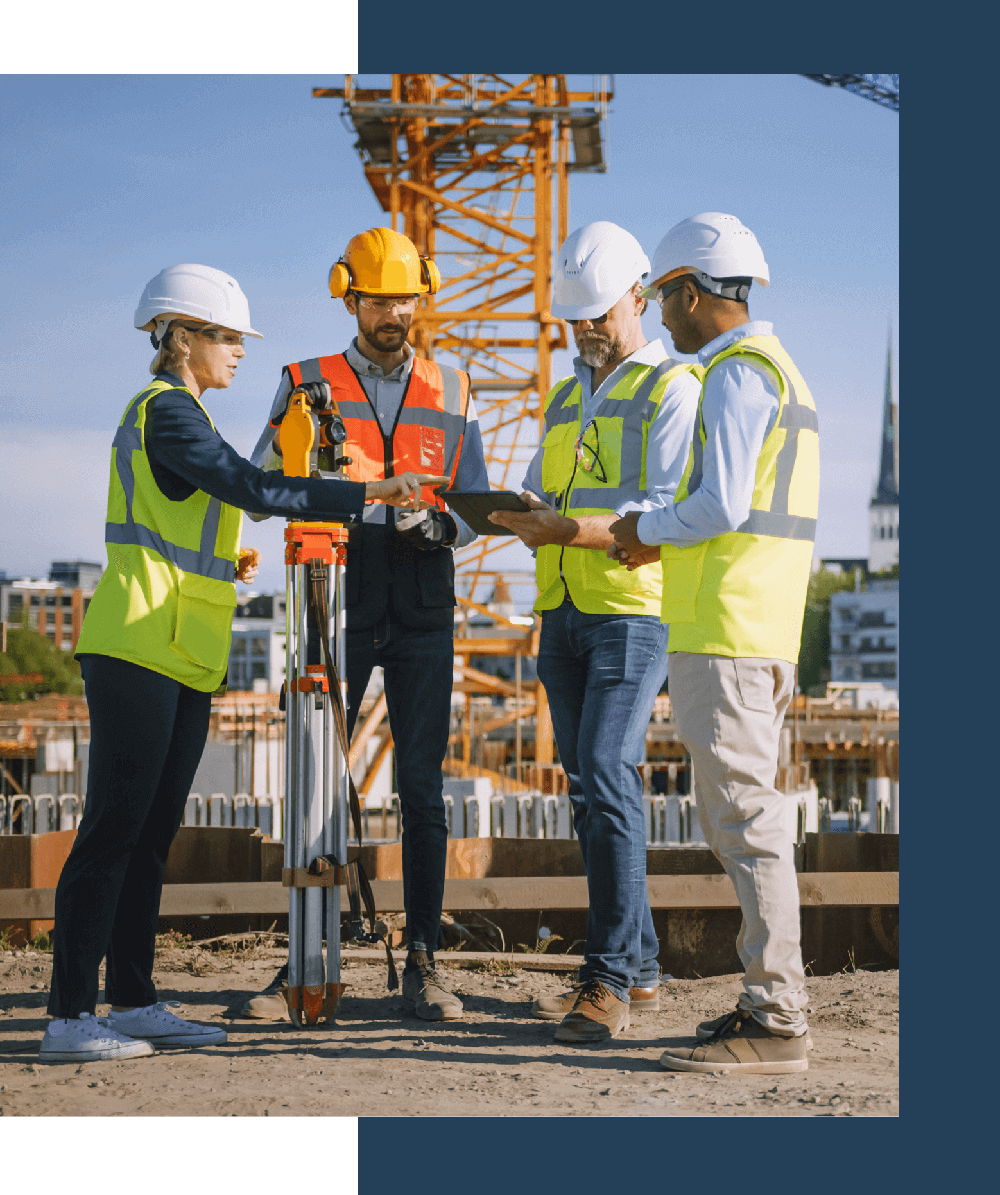 group of people talking at a construction site